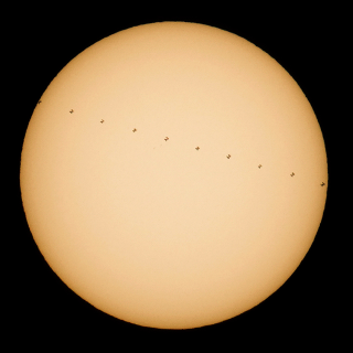 Photo Credit: (NASA/Joel Kowsky) This composite image, made from ten frames, shows the International Space Station, with a crew of six onboard, in silhouette as it transits the sun at roughly five miles per second, Saturday, Dec. 17, 2016, from Newbury Park, California. Onboard as part of Expedition 50 are: NASA astronauts Shane Kimbrough and Peggy Whitson: Russian cosmonauts Andrey Borisenko, Sergey Ryzhikov, and Oleg Novitskiy: and ESA (European Space Agency) astronaut Thomas Pesquet.